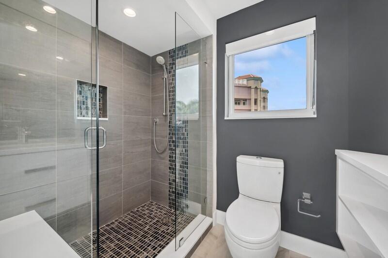 300 Southeast 5th Avenue, Unit 5180 Boca Raton, FL 33432 - Photo 29 of 45 a bathroom with a toilet sink and shower