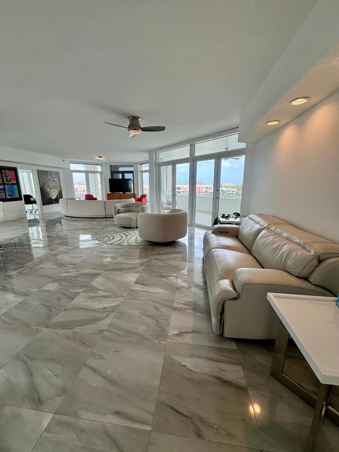 300 Southeast 5th Avenue, Unit 5180 Boca Raton, FL 33432 - Photo 4 of 45 a living room with furniture and a flat screen tv