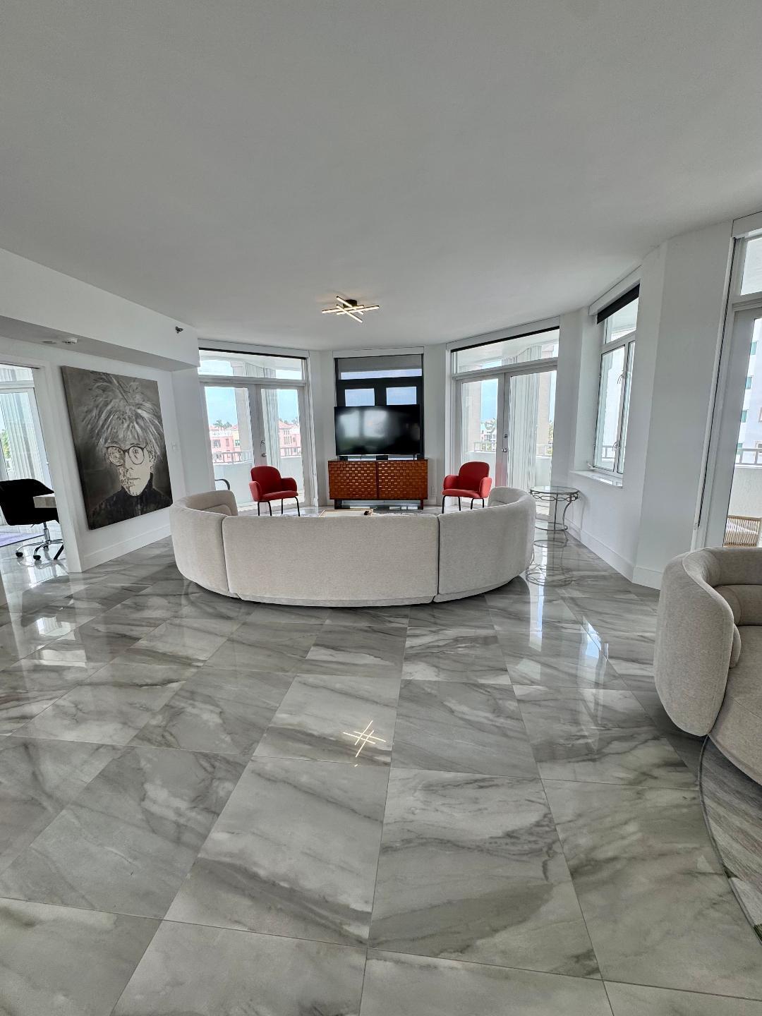 300 Southeast 5th Avenue, Unit 5180 Boca Raton, FL 33432 - Photo 6 of 45 a living room with furniture and a flat screen tv