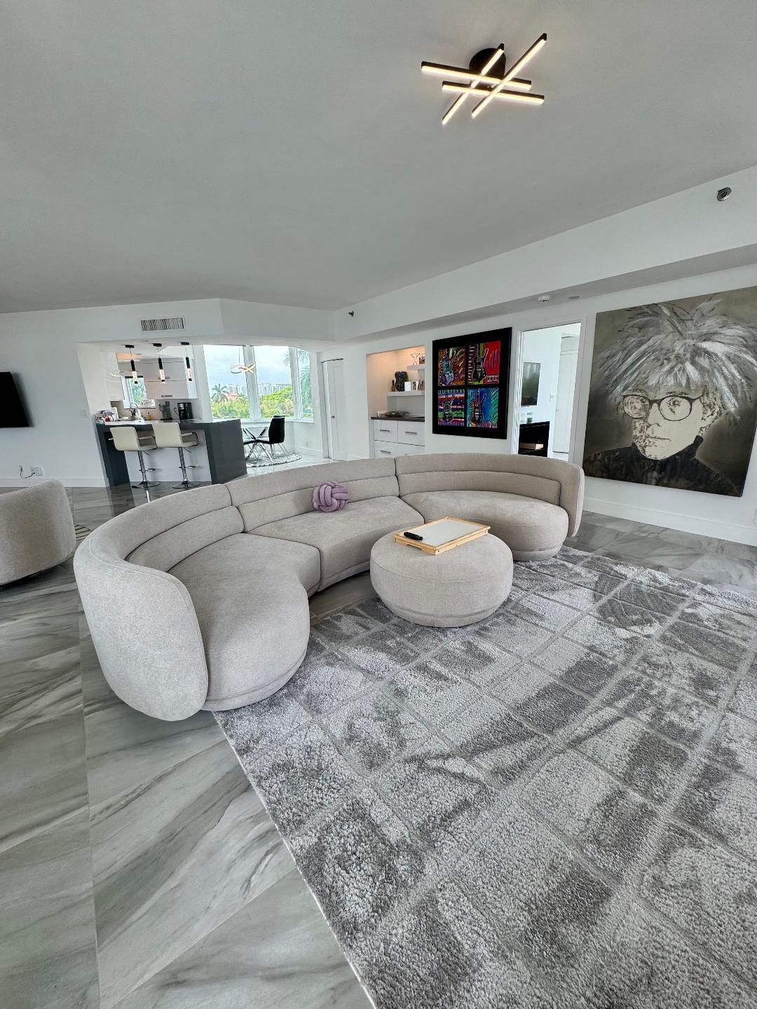 300 Southeast 5th Avenue, Unit 5180 Boca Raton, FL 33432 - Photo 7 of 45 a living room with furniture and a flat screen tv