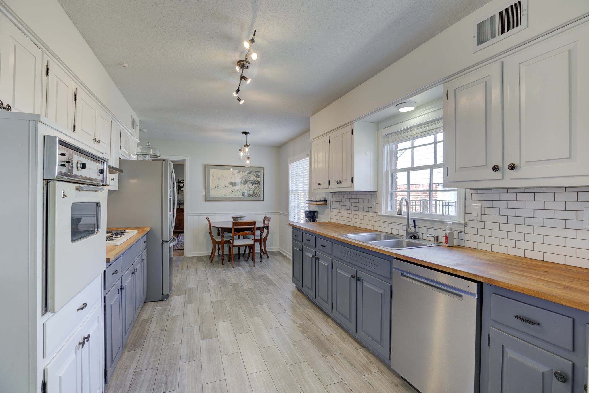 6461 Messick Road Memphis, TN 38119 - Photo 12 of 25 Mini Subway Tiled Backsplash, Butcher Block Countertops, New Hardware and Lighting