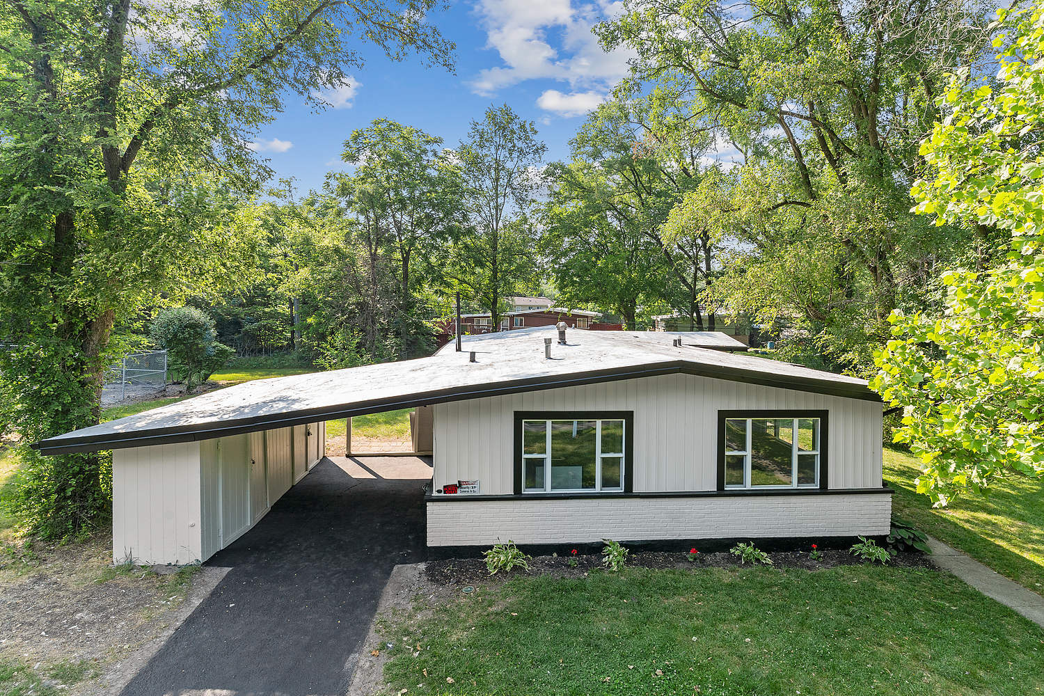 Undisclosed Address Park Forest, IL 60466 - Photo 15 of 16 a view of a house with a yard plants and large tree