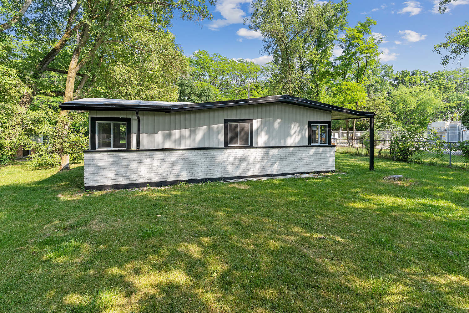 Undisclosed Address Park Forest, IL 60466 - Photo 16 of 16 a front view of a house with a yard and garage