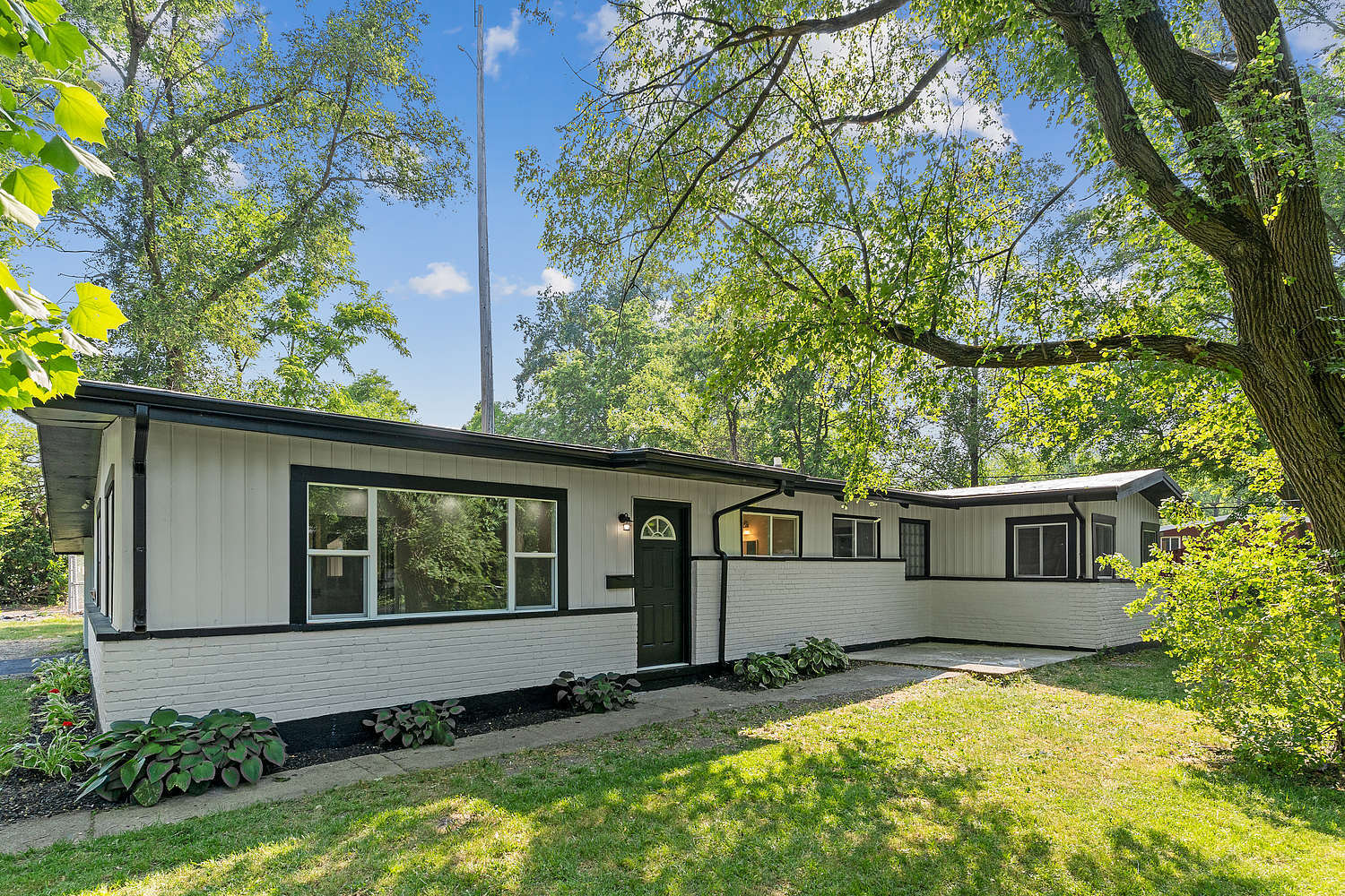 Undisclosed Address Park Forest, IL 60466 - Photo 2 of 16 a view of a house with a yard