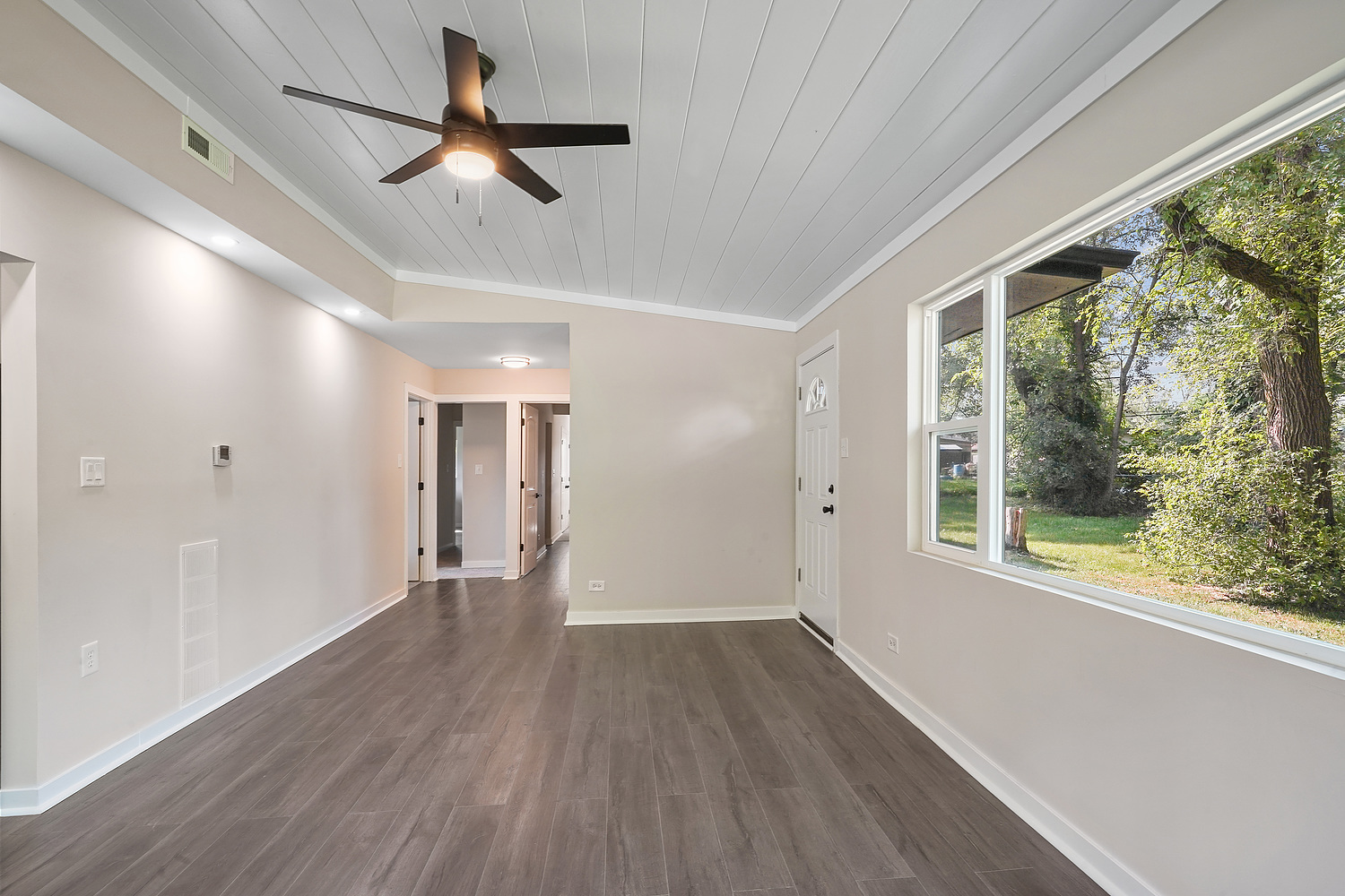 Undisclosed Address Park Forest, IL 60466 - Photo 7 of 16 a view of empty room with wooden floor and fan