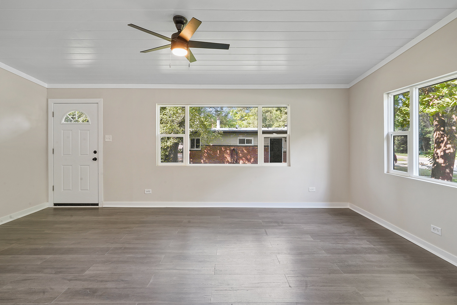 Undisclosed Address Park Forest, IL 60466 - Photo 8 of 16 wooden floor in an empty room with a window