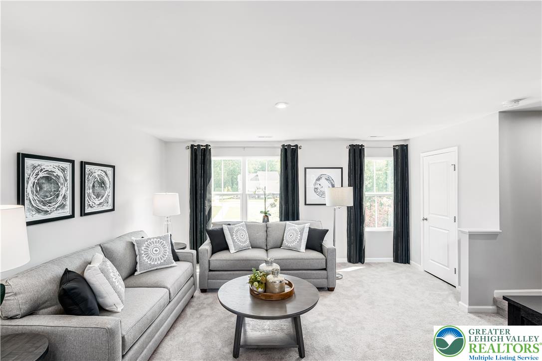 107 Shiloh Road, Unit J3 Orwigsburg, PA 17961 - Photo 11 of 13 a living room with furniture and a large window