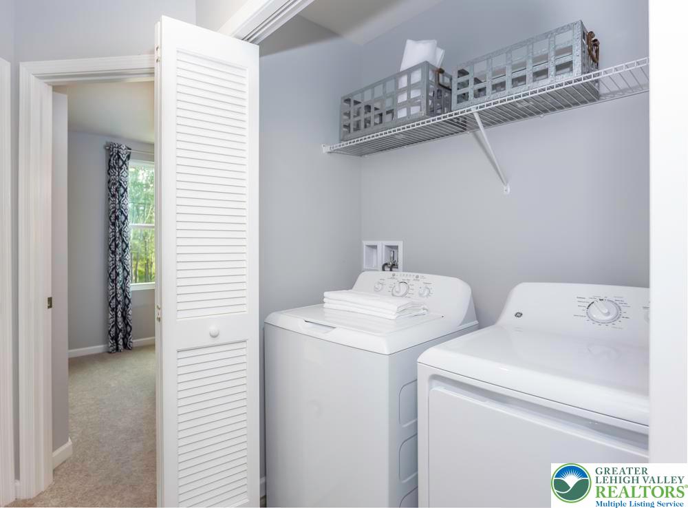 107 Shiloh Road, Unit J3 Orwigsburg, PA 17961 - Photo 5 of 13 a utility room with dryer and washer
