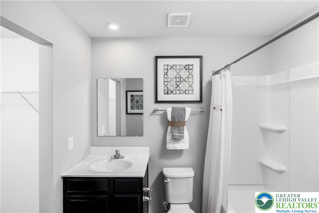 107 Shiloh Road, Unit J3 Orwigsburg, PA 17961 - Photo 8 of 13 a bathroom with a sink toilet and shower