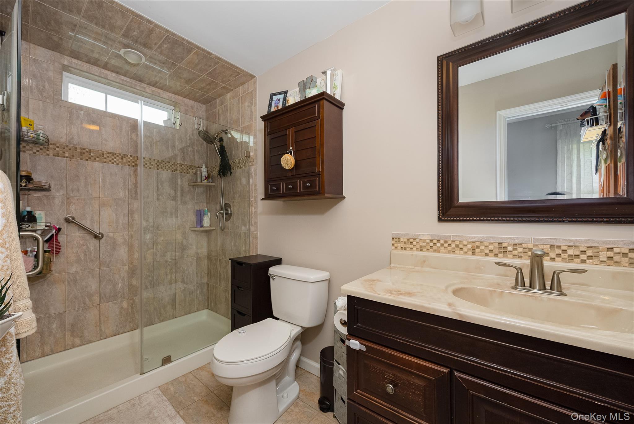 6 Grapevine Place Poughkeepsie, NY 12603 - Photo 14 of 24 a bathroom with a sink a toilet and shower