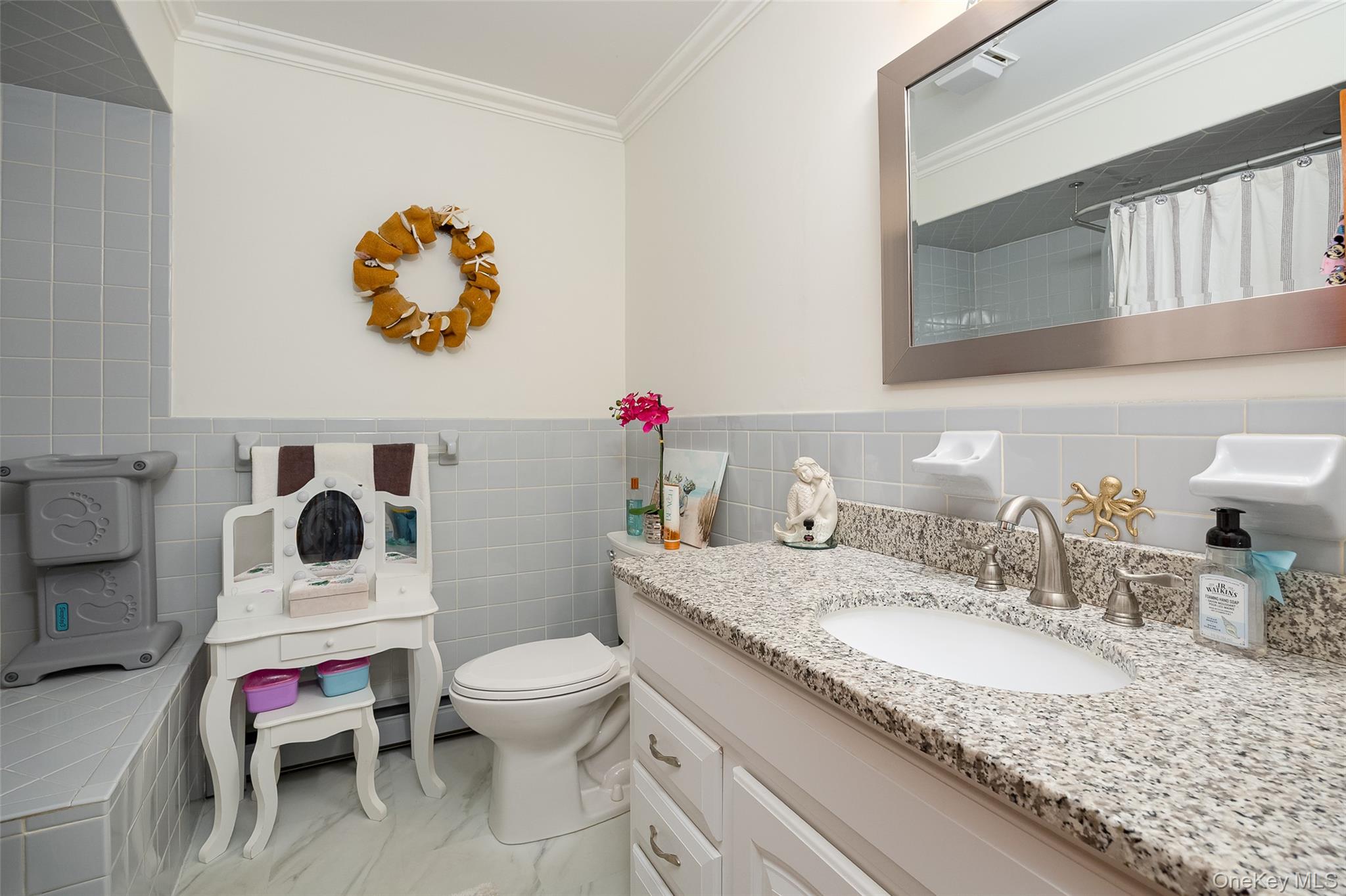 6 Grapevine Place Poughkeepsie, NY 12603 - Photo 16 of 24 a bathroom with a granite countertop toilet sink and mirror