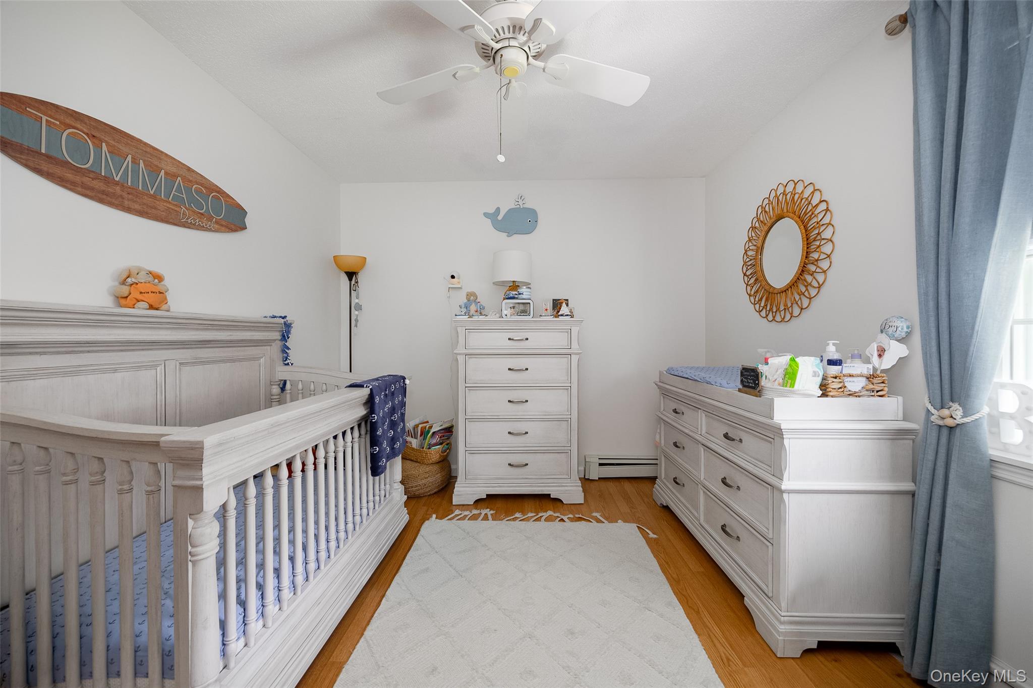 6 Grapevine Place Poughkeepsie, NY 12603 - Photo 17 of 24 a bedroom with a bed and a chandelier