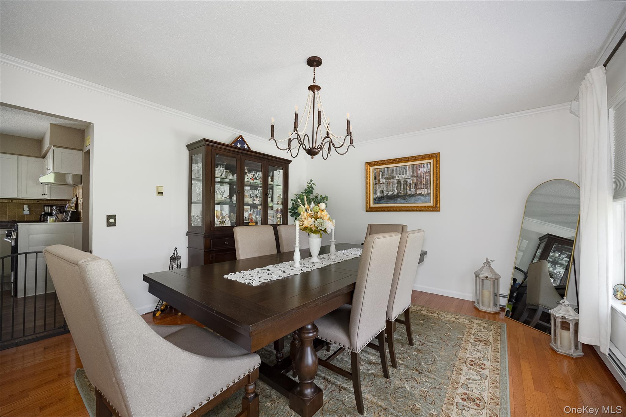 6 Grapevine Place Poughkeepsie, NY 12603 - Photo 6 of 24 a dining room with furniture a chandelier and wooden floor
