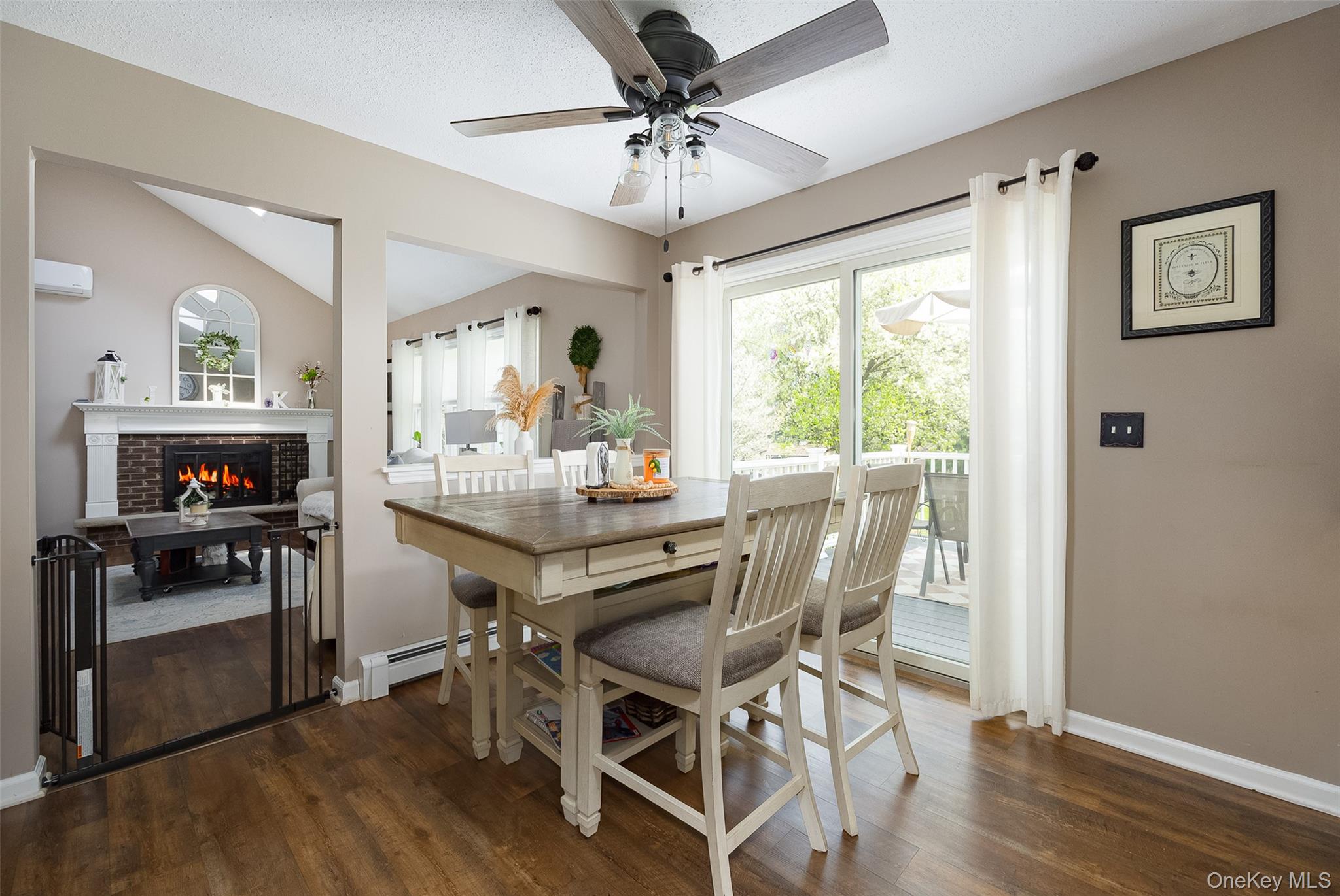 6 Grapevine Place Poughkeepsie, NY 12603 - Photo 9 of 24 a dining room with furniture a chandelier and wooden floor