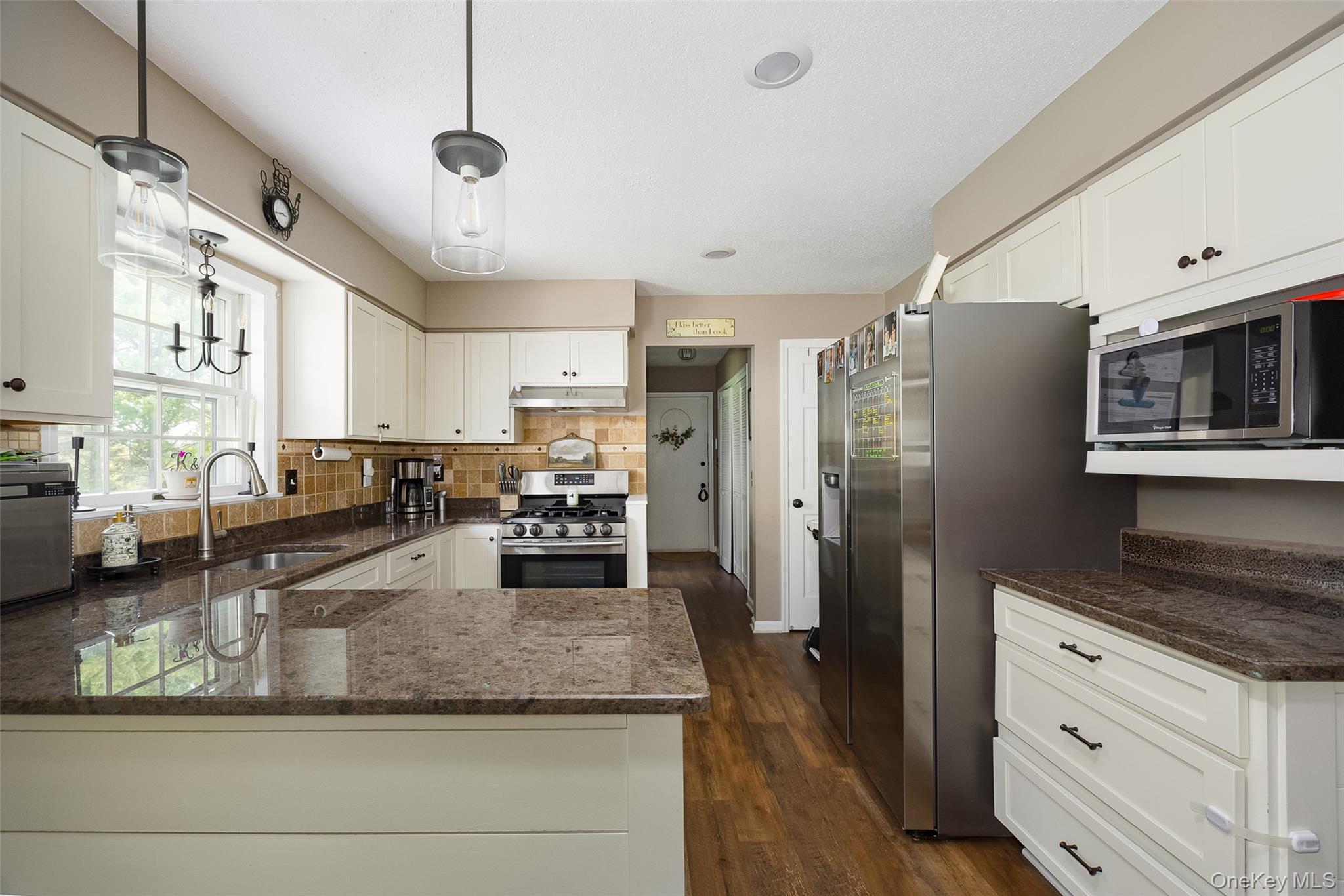 6 Grapevine Place Poughkeepsie, NY 12603 - Photo 10 of 24 a large kitchen with granite countertop lots of counter space wooden floor and stainless steel appliances
