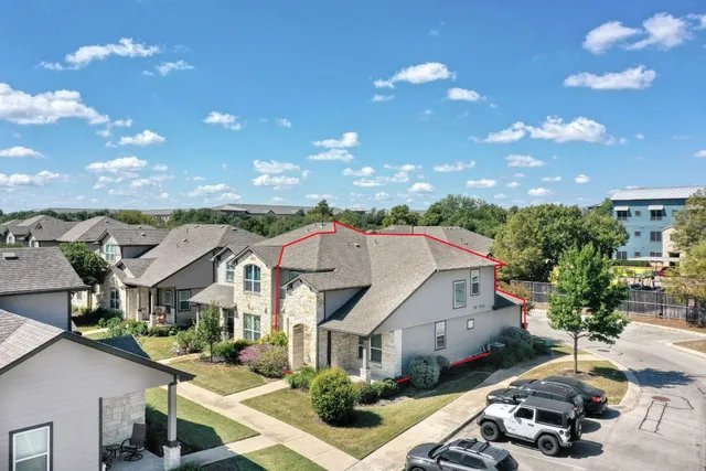 a front view of a house with yard and mountain view