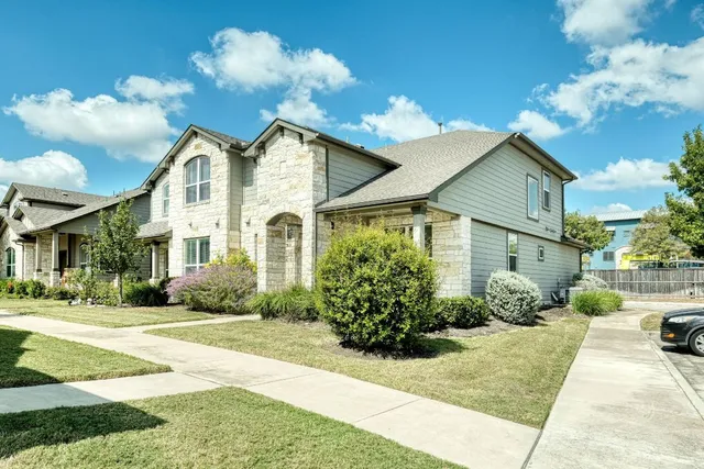 a front view of a house with garden