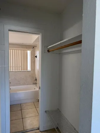 a bathroom with a bathtub and toilet