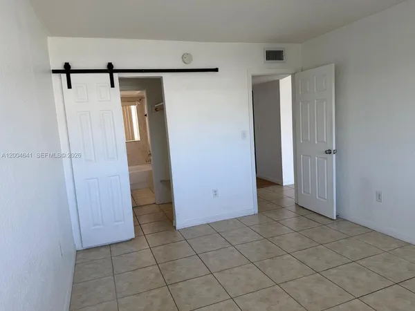 a view of a storage & utility room with wooden floor
