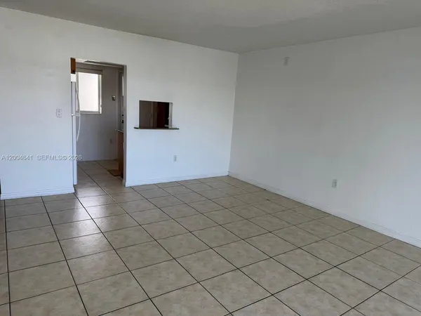 an empty room with white walls