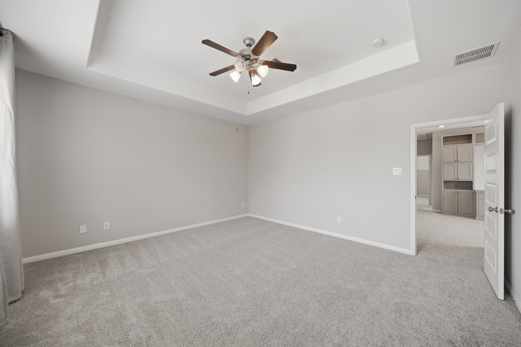 4103 Tranquil Square Road Houston, TX 77043 - Photo 20 of 39 Designed with comfort in mind, the spacious primary suite offers a calm, restful ambiance and room to truly unwind. To the right sits the primary bath.