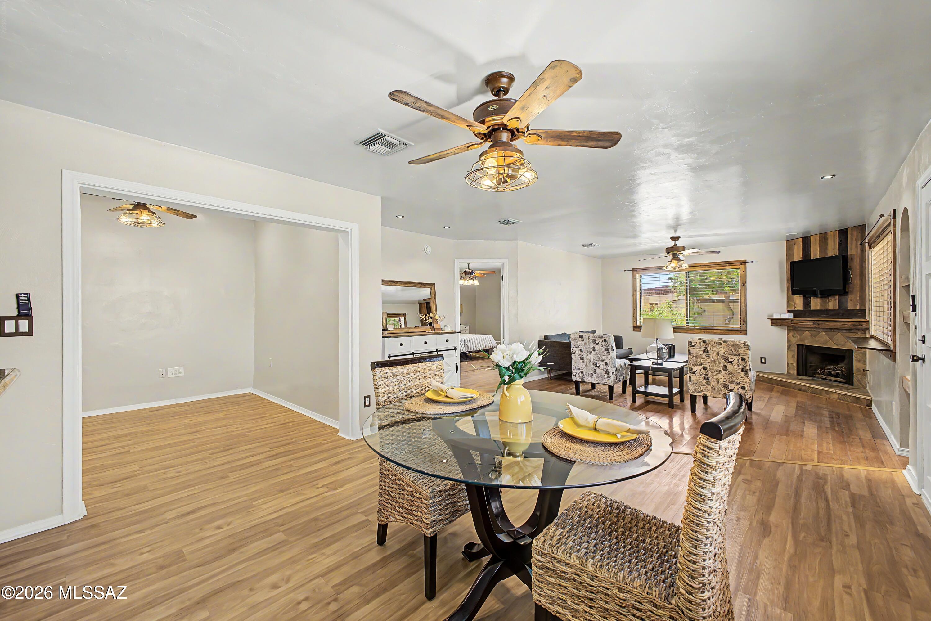 3781 East Edison Street Tucson, AZ 85716 - Photo 7 of 28 a view of a dining room with furniture and wooden floor