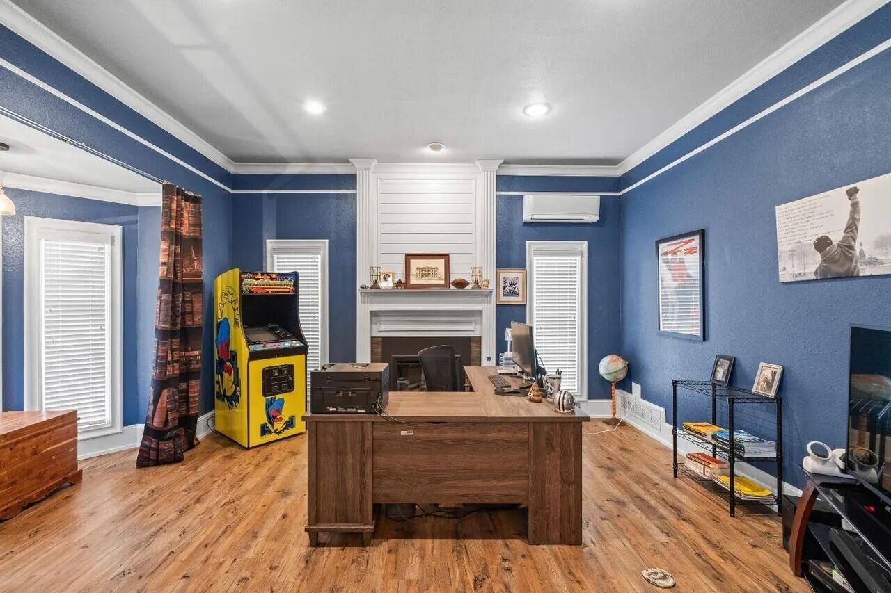 7201 87th Street Lubbock, TX 79424 - Photo 5 of 43 a living room with fireplace furniture and a flat screen tv