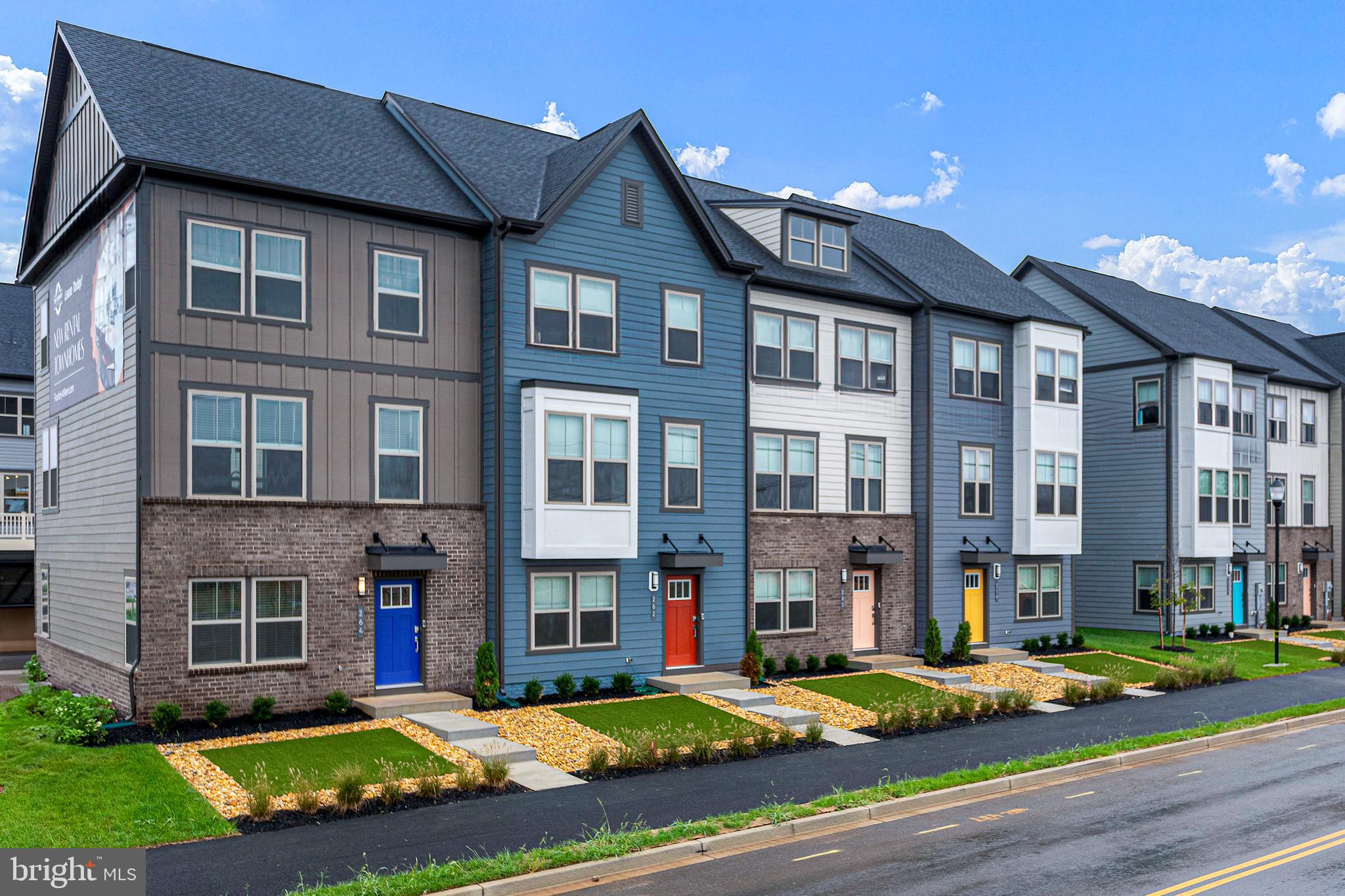 a view of a big house with a yard