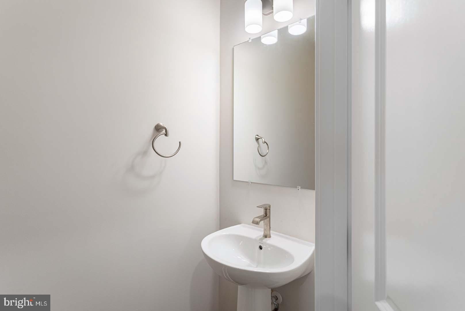 231 Matilda Frederick, MD 21701 - Photo 22 of 26 a bathroom with a sink and mirror