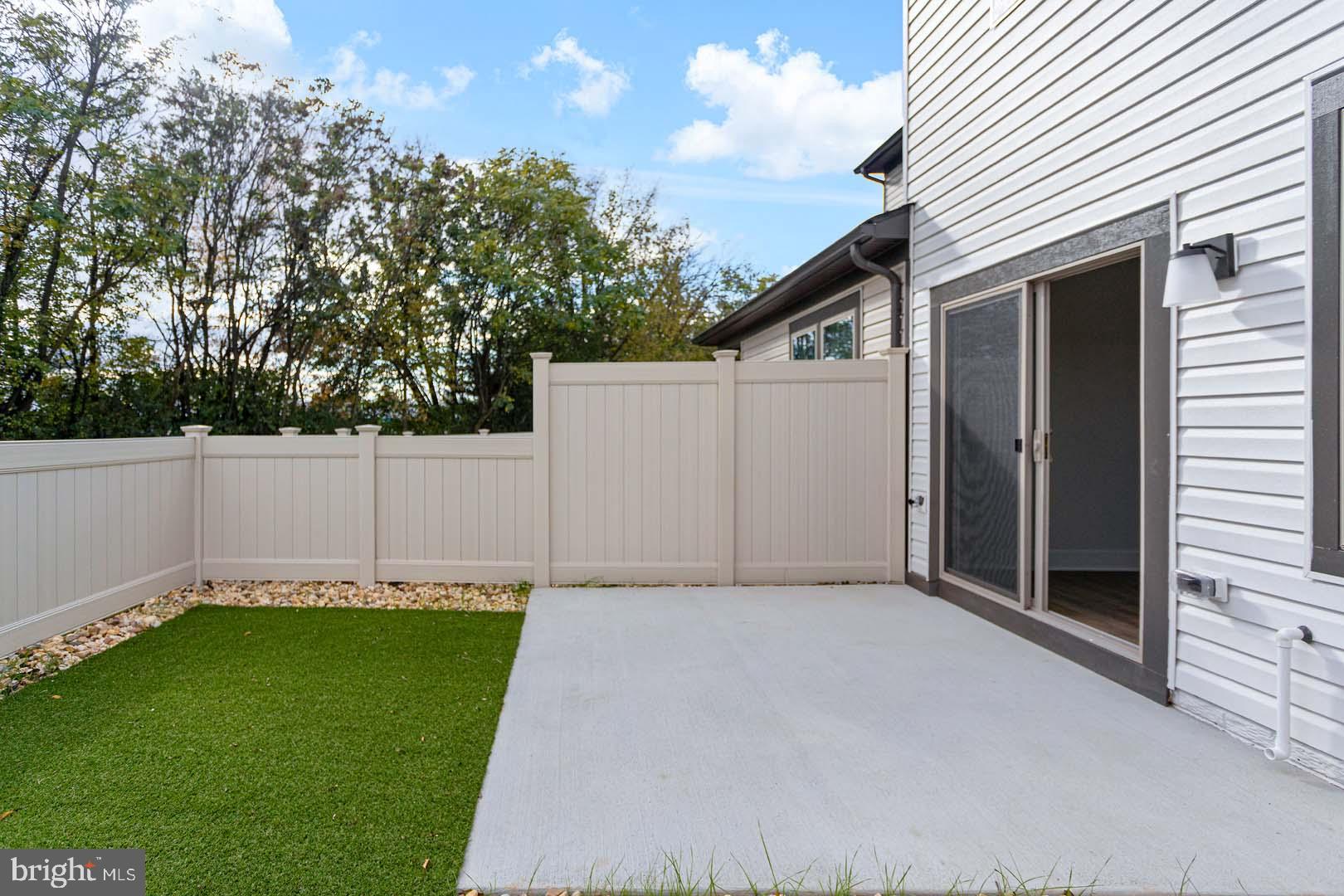 231 Matilda Frederick, MD 21701 - Photo 23 of 26 a view of a backyard with white wall and wooden fence