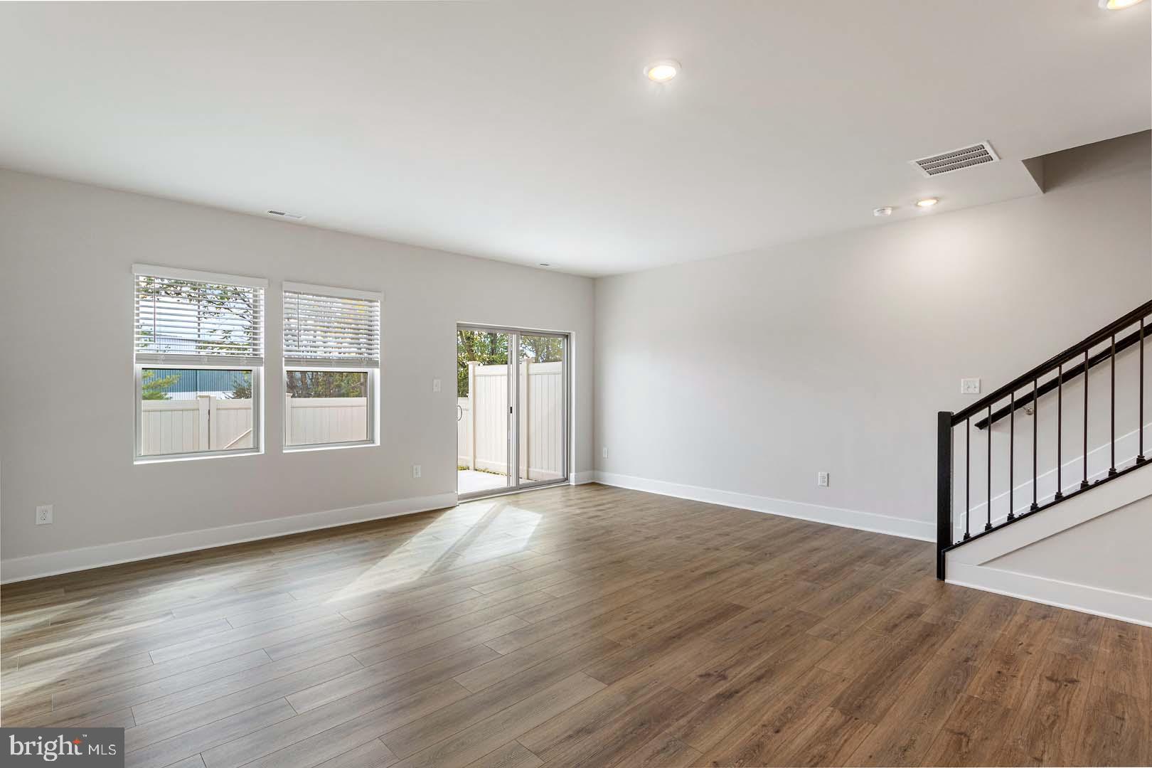 231 Matilda Frederick, MD 21701 - Photo 3 of 26 a view of an empty room with wooden floor and a window