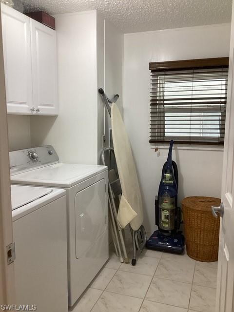 225 Belle Isle Circle Naples, FL 34112 - Photo 14 of 48 a utility room with dryer and washer