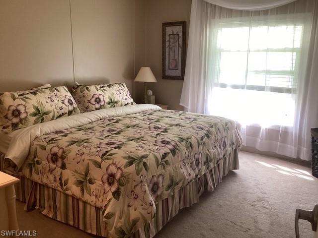 225 Belle Isle Circle Naples, FL 34112 - Photo 21 of 48 a bedroom with a bed and a window