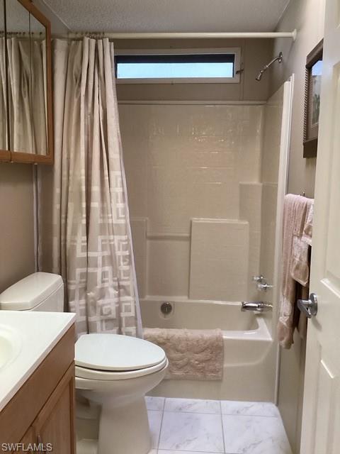 225 Belle Isle Circle Naples, FL 34112 - Photo 23 of 48 a bathroom with a sink a toilet and shower
