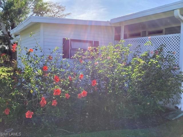 225 Belle Isle Circle Naples, FL 34112 - Photo 32 of 48 a front view of a house with plants