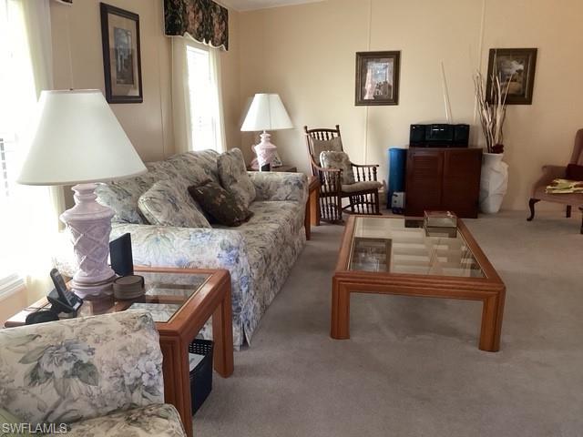 225 Belle Isle Circle Naples, FL 34112 - Photo 5 of 48 a living room with furniture and a table