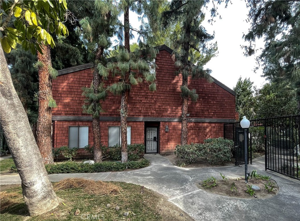 348 South Prospectors Road, Unit 4 Diamond Bar, CA 91765 - Photo 1 of 1 a brick building with a tree in front of it