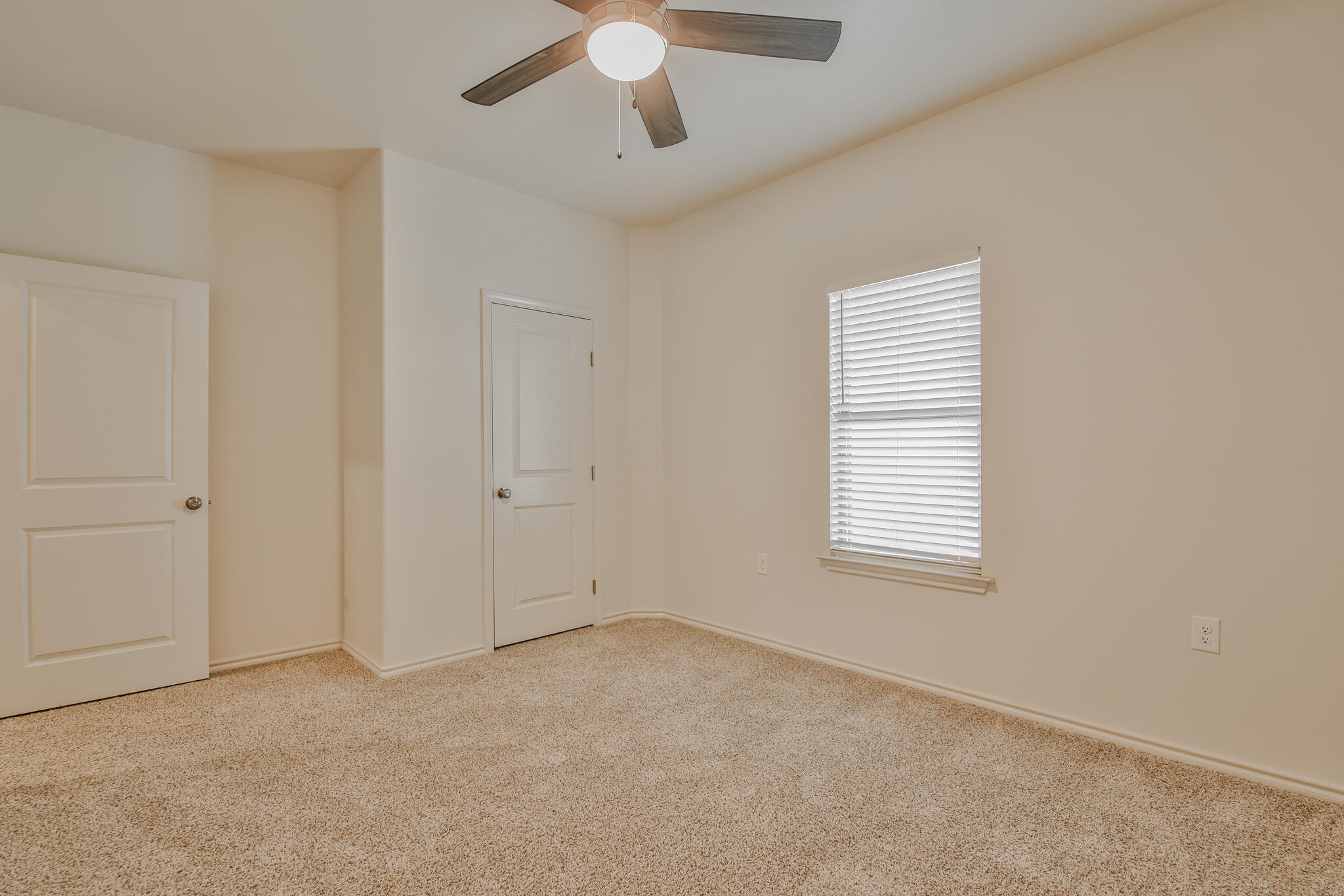 5508 Kemper Street Lubbock, TX 79416 - Photo 17 of 26 a view of an empty room with a window
