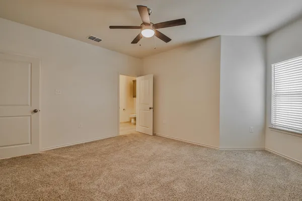 a view of an empty room and window