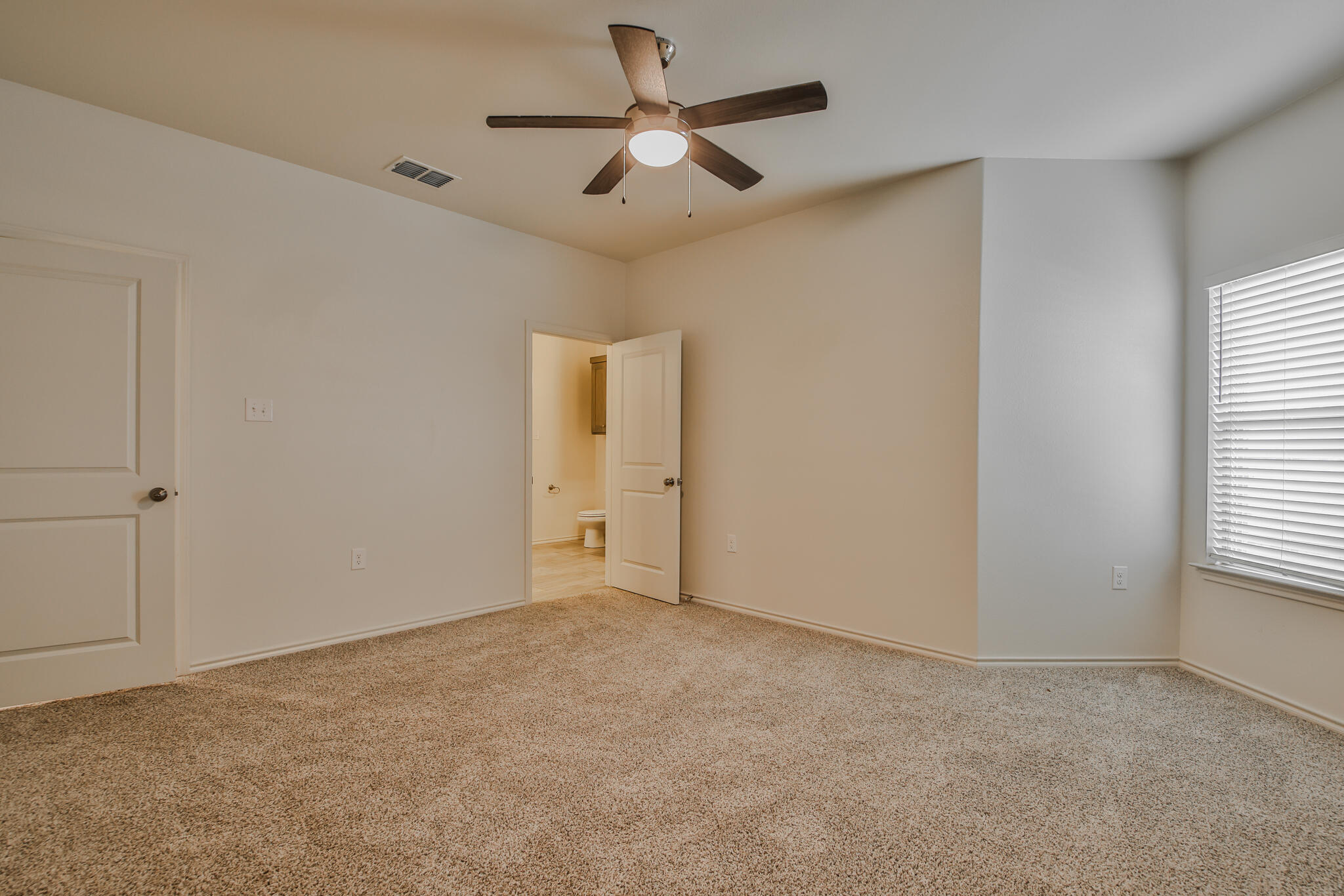 5508 Kemper Street Lubbock, TX 79416 - Photo 20 of 26 a view of an empty room and window