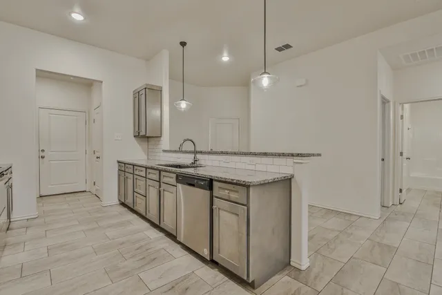 a bathroom with a double vanity sink a mirror and a shower