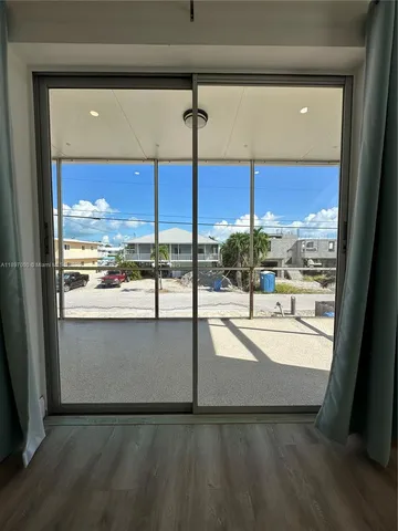 a front view of a building with glass windows and a table