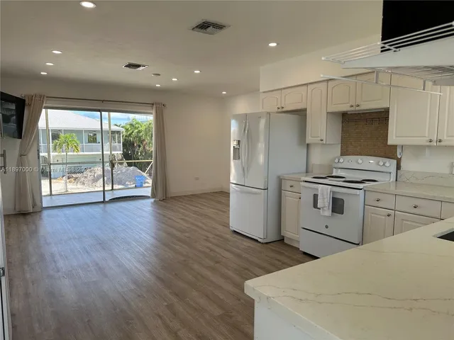a view of a chair and tables in the balcony