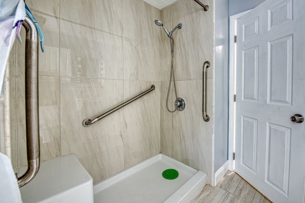 81 Errol Road Brockton, MA 02302 - Photo 16 of 31 a bathroom with a shower and a tub
