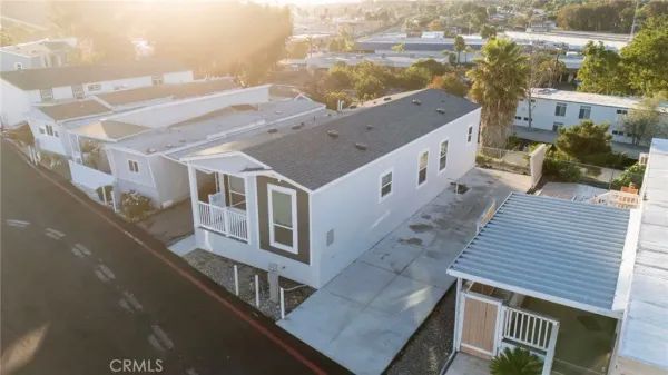 an aerial view of residential houses with outdoor space