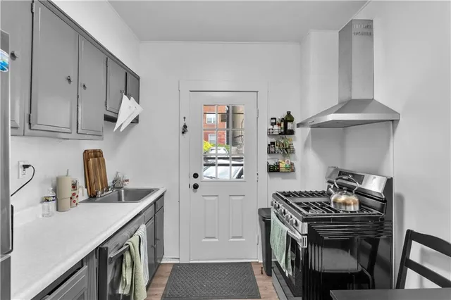 a view of a dining room with furniture and a window