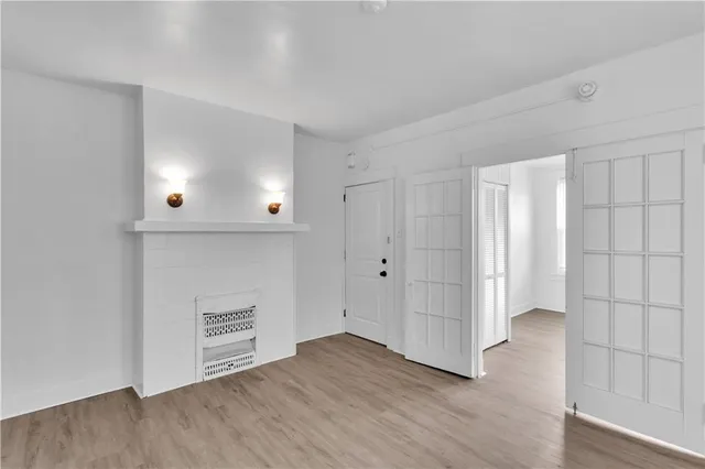 an empty room with wooden floor