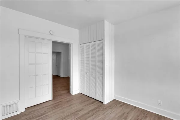 a kitchen with a sink cabinets and stainless steel appliances