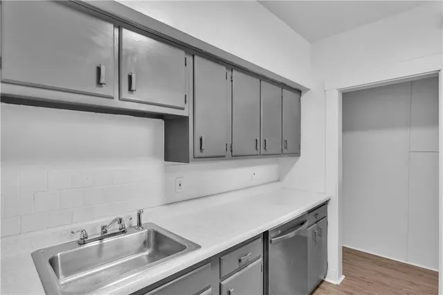 a kitchen with a refrigerator and cabinets