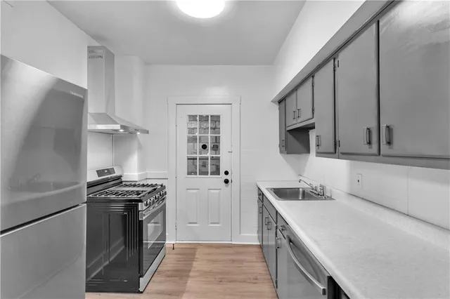 a bathroom with a bathtub and a sink